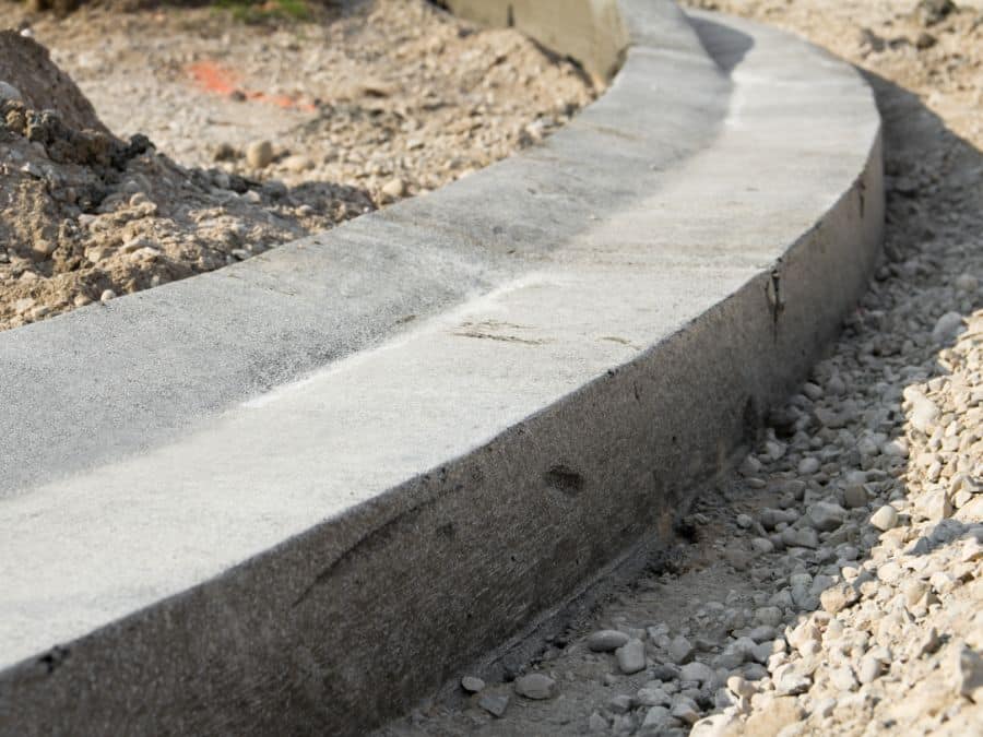 We're Not Just Pouring Concrete, We're Crafting Extensive Concrete Curb and Gutter Systems That Blend Aesthetics with Functionality